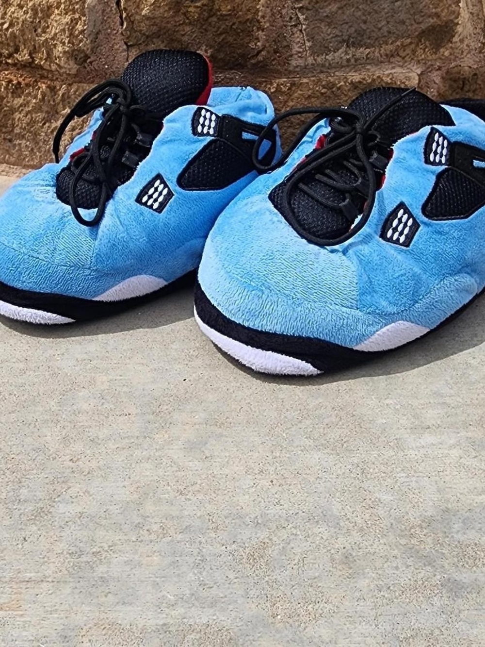 Air Jordan 4s Kids Light Blue Plush Lace-Up Sneakers with Black Accents
